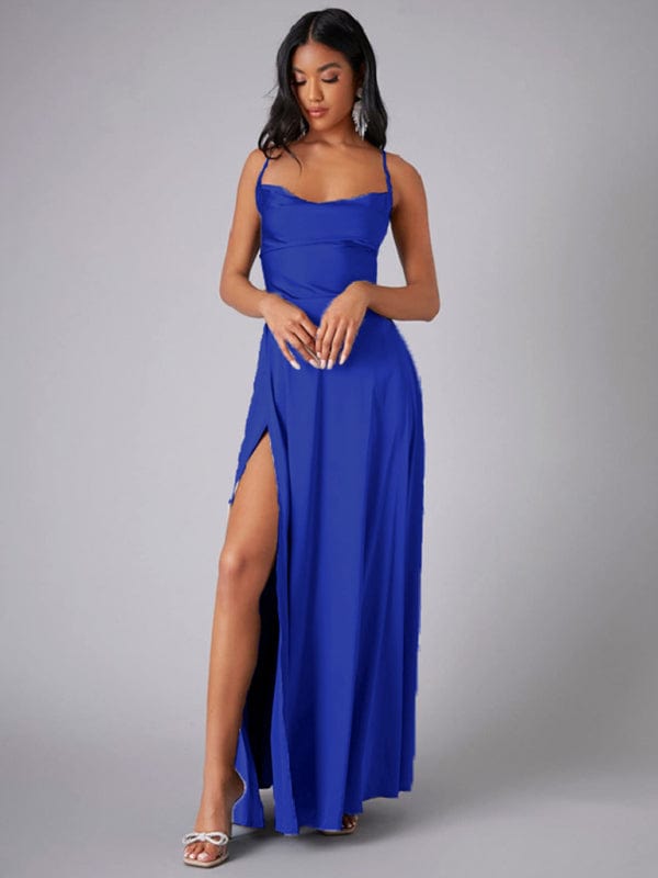 Model posing in a blue floor-length evening gown with thigh-high slit and sweetheart neckline,