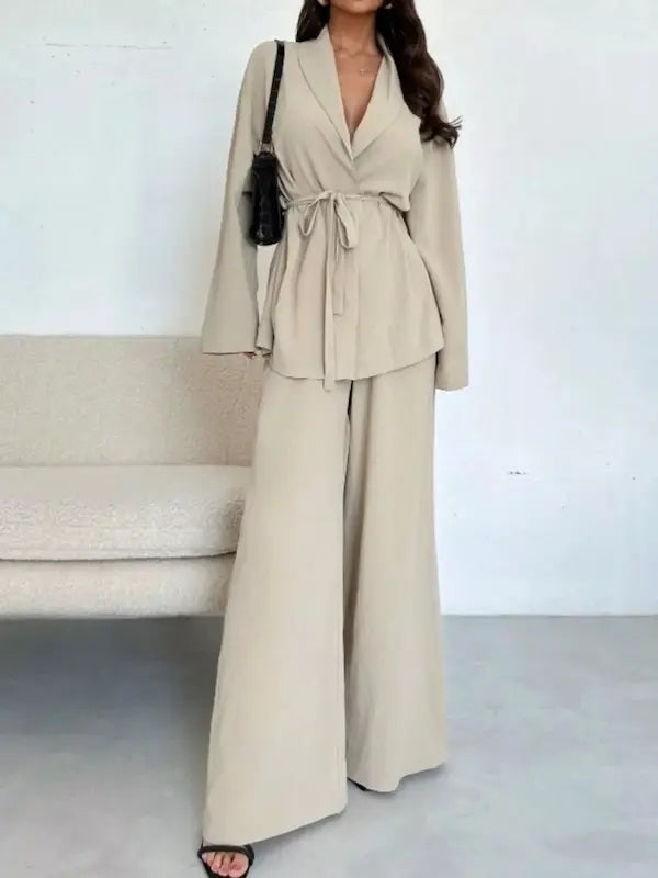 Cream wrap blazer and wide-leg pants two-piece set styled with black heels and crossbody bag for sophisticated look.