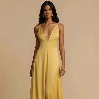 Woman wearing a yellow dress against a beige background.
