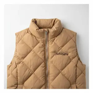 Beige puffer vest with a brand logo on a light gray background.