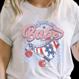 Person wearing a white t-shirt with 'American Babe' graphic design.