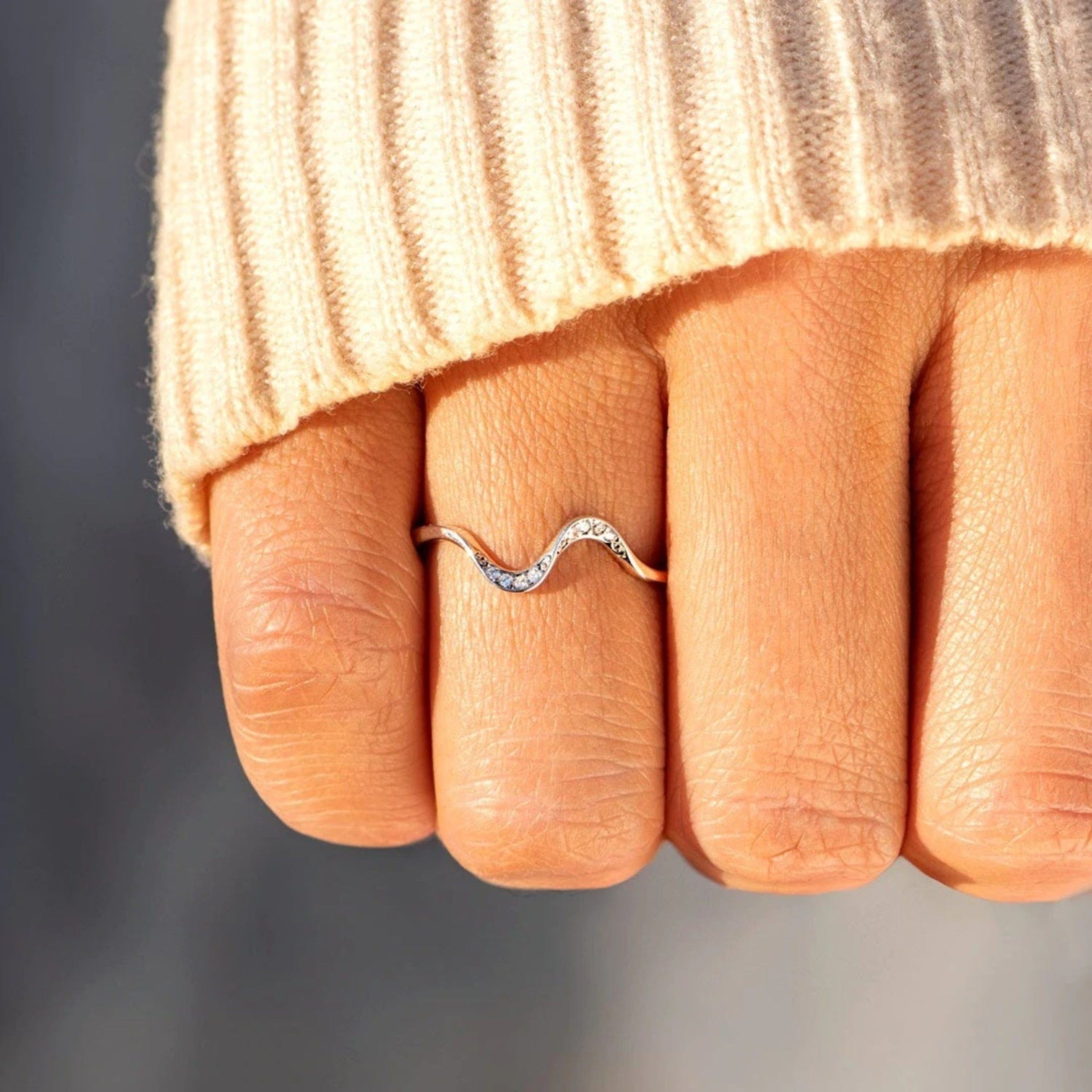 Close-up of a woman's hand adorned with a stylish ring